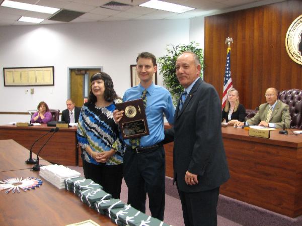 Doctor Hornstein receiving an award for Monroe Animal Hospital Handicap Accesibility 