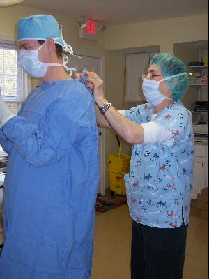 Gowning up before spay surgery at the Monroe Animal Hospital